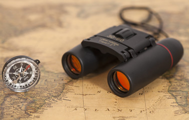 Binocular and compass on map