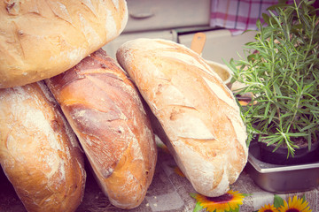 Vintage photo, Freshly baked traditional loaves of rye bread on stall