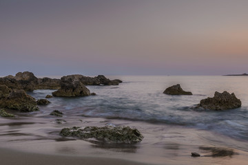 Fototapeta na wymiar Sunset over the beach on the Mediterranean island of Cyprus.