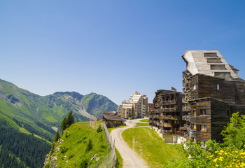  Strange wooden  buildings in  Avoriaz , French mountain resort, in the middle of the Porte du Soleil , Alps Mountains. - obrazy, fototapety, plakaty