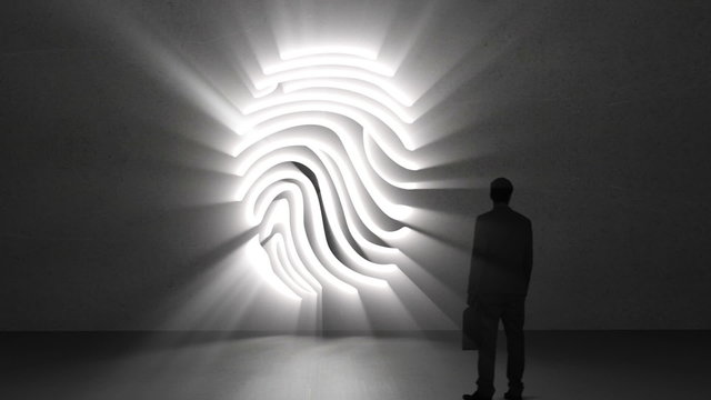 Businessman looking at giant fingerprint