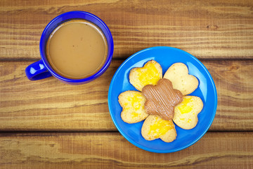 Drinking coffee in the fall on wooden table 