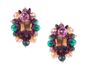 Pair of luxury jewelry earrings with crystals and natural stones isolated on white