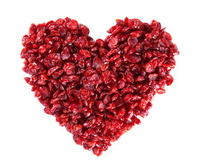 Fototapeta na wymiar Dry cranberry in a heart shape on white background