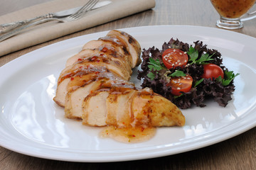 Slices of chicken fillet with sauce