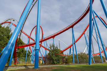 Fototapeta na wymiar Roller Coaster in funny amusement park.