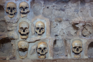 Wall with human skulls