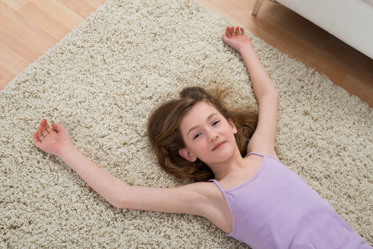 Girl Resting On Carpet After Workout