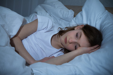Obraz na płótnie Canvas Girl Having Sleeplessness Night