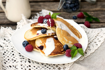 Homemade pancakes with raspberries and blueberries