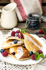Homemade pancakes with raspberries and blueberries