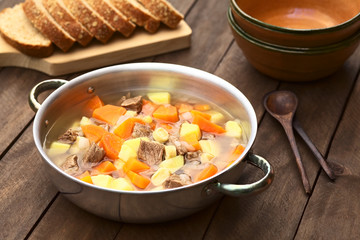 Traditional Hungarian soup called Gulyasleves made of beef, potato, carrot, onion, csipetke (homemade pasta) (Selective Focus, Focus one third into the soup)