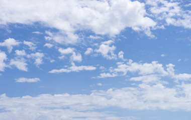 blue sky background with tiny clouds