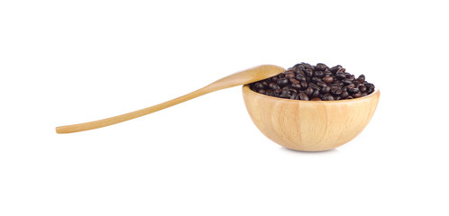 Coffee beans in wooden cup and spoon on white background