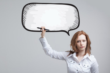woman writes in a painted  speech cloud