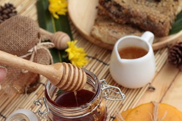 Honey variety with honeycomb and honey in a jar with beeswax.