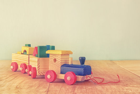 Wooden toy train over wooden table