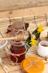 Honey variety with honeycomb and honey in a jar with beeswax.