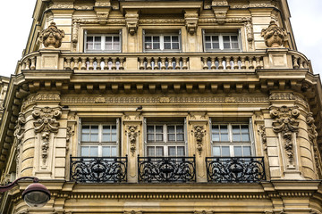 French house with traditional balconies and windows. Paris.