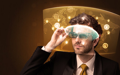 Young man looking at futuristic social network map