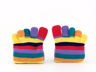 close-up colorful striped long finger socks isolated on white background, vivid colors five toes socks winter fashion for teenage female or children