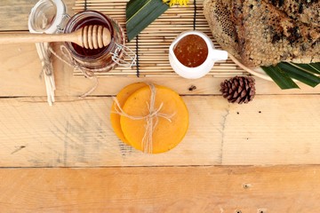 Honey variety with honeycomb and honey in a jar with beeswax.