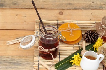 Honey variety with honeycomb and honey in a jar with beeswax.
