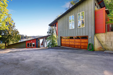 Modern house with garage and a view of the lake.