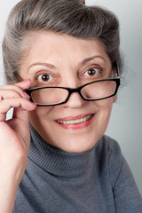 Fototapeta premium Portrait of senior lady wearing glasses