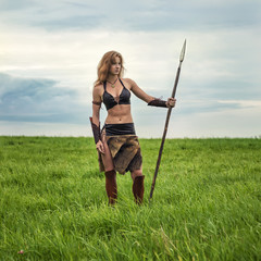 Girl warrior in the field. Amazon on patrol.