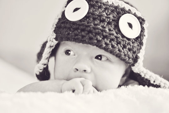 cute newborn wearing funny hat