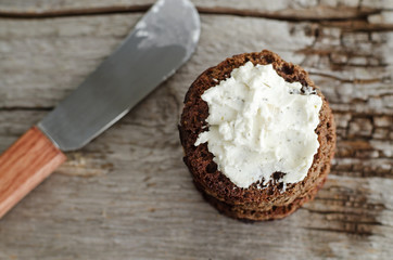 Small round rye toasts with cream cheese