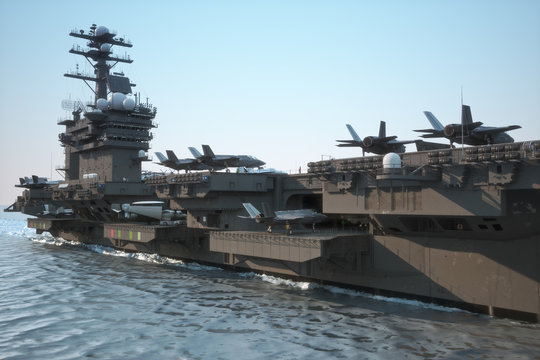 Navy aircraft carrier angled view, with a large compartment of jet aircraft and crew.