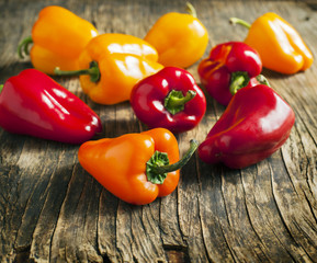 Sweet peppers on wooden background