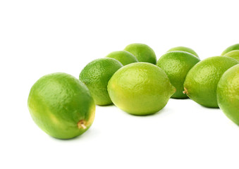 Surface covered with multiple ripe limes, composition isolated