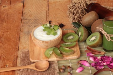 Yogurt white with green kiwi fruit and kiwi juice.