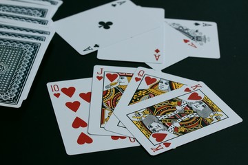 Playing cards on black background