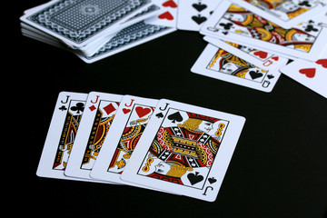Playing cards on black background