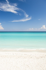 Shore of classic turquoise Caribbean Sea dream beach under bright blue sky near the resort town of Varadero, Cuba