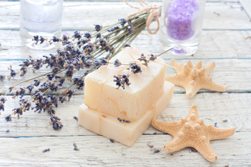 Obraz na płótnie Canvas Spa set with lavender, handmade soap,sea salt and seastars
