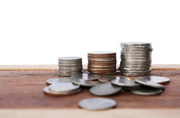 Baht Thailand coins arranged Rank for currency on the wooden floor and white background.