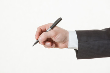 Businessman's hand holding a pen