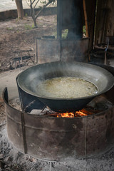 Cooking sliced  cabbage soup in big pot on top of the stove