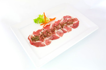 freshness slided pork on white dish for grill