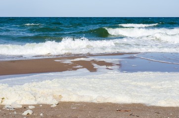 White foam on a sea water surface