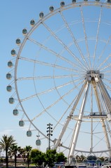Ferris Wheel Over Blue Sky
