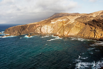 Sea surf on the rocks in area  Punta Pesebre  on Fuerteventura