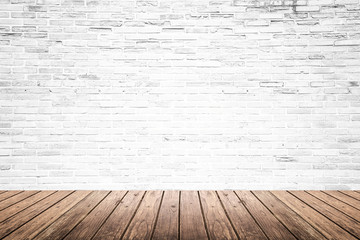 Old interior room with brick wall and wood floor