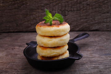 Syrniki (Cottage cheese pancakes, Fritters of cottage cheese) traditional Ukrainian and Russian cuisine.