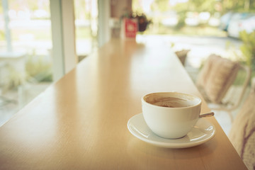 hot of coffee drink on wooden table bar in the cafe